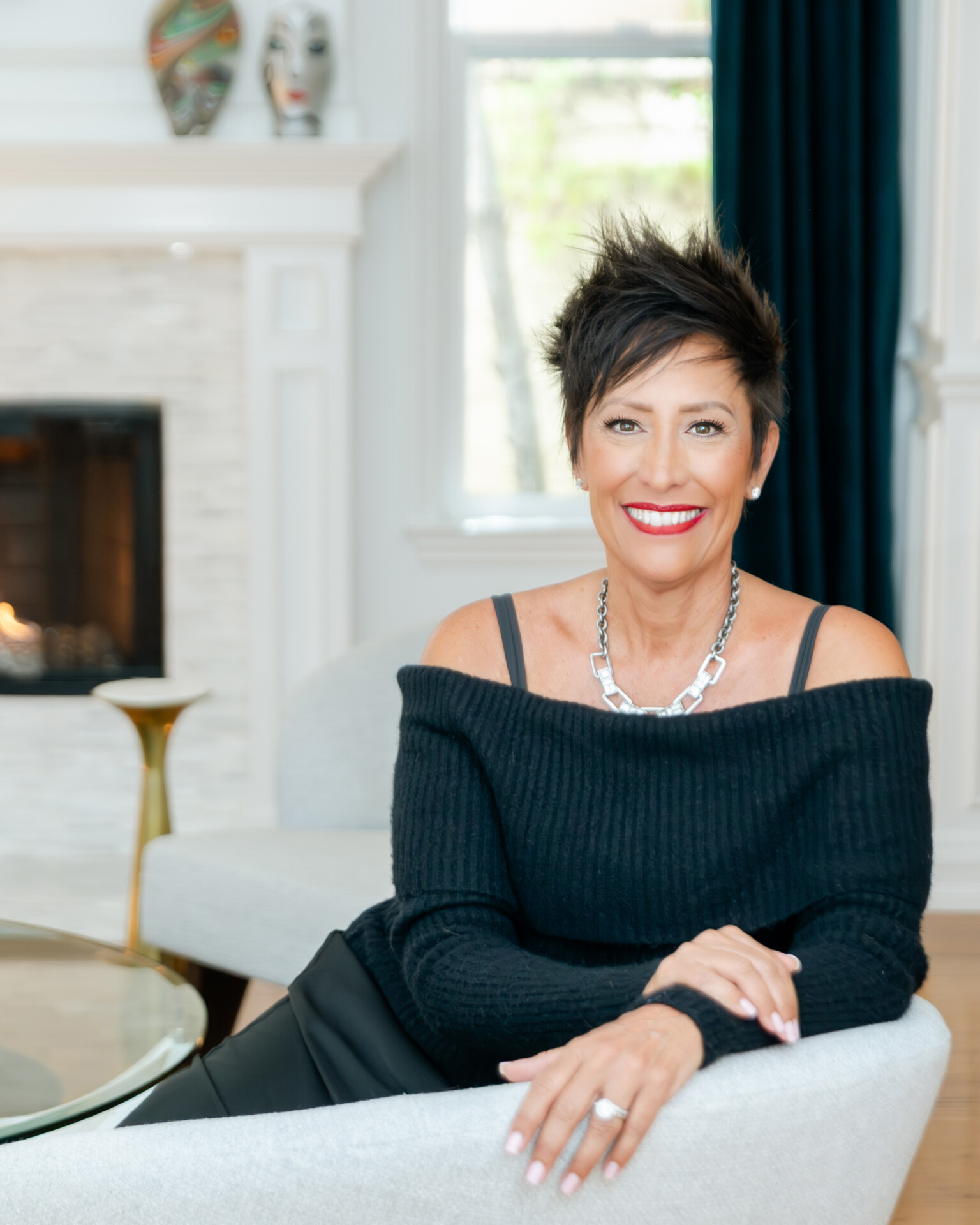 Gina Maier Vincent seated in an elegant private interior